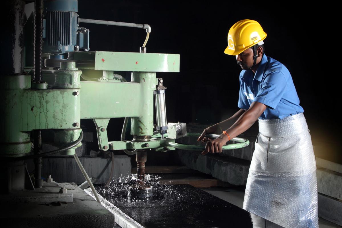 Worker working with granite